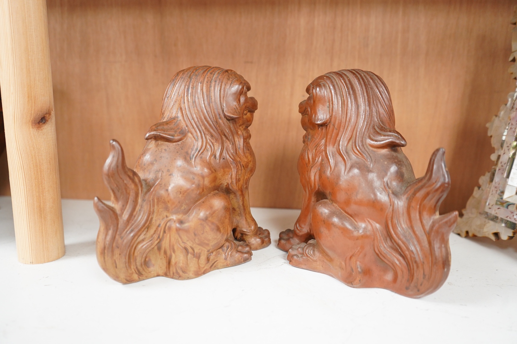 A pair of Japanese Bizan ware lion dogs (shi shi), 18cm high